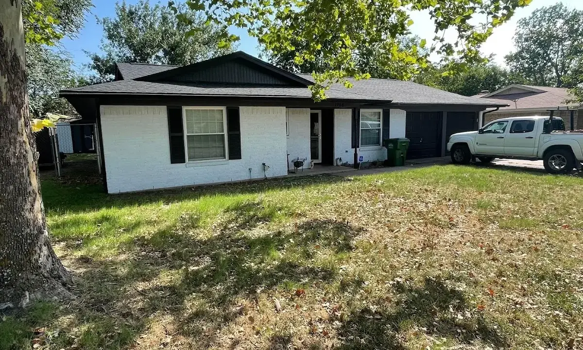 Professional roofing crew working on a residential roof in Bainbridge